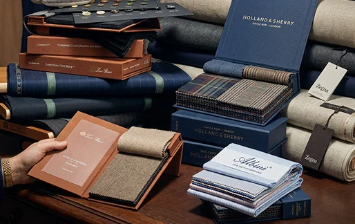 Stacks of luxury fabric samples and swatches in various colors