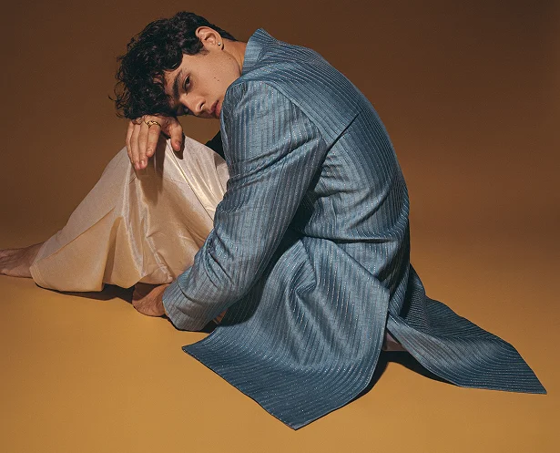Person wearing azure silk kurta